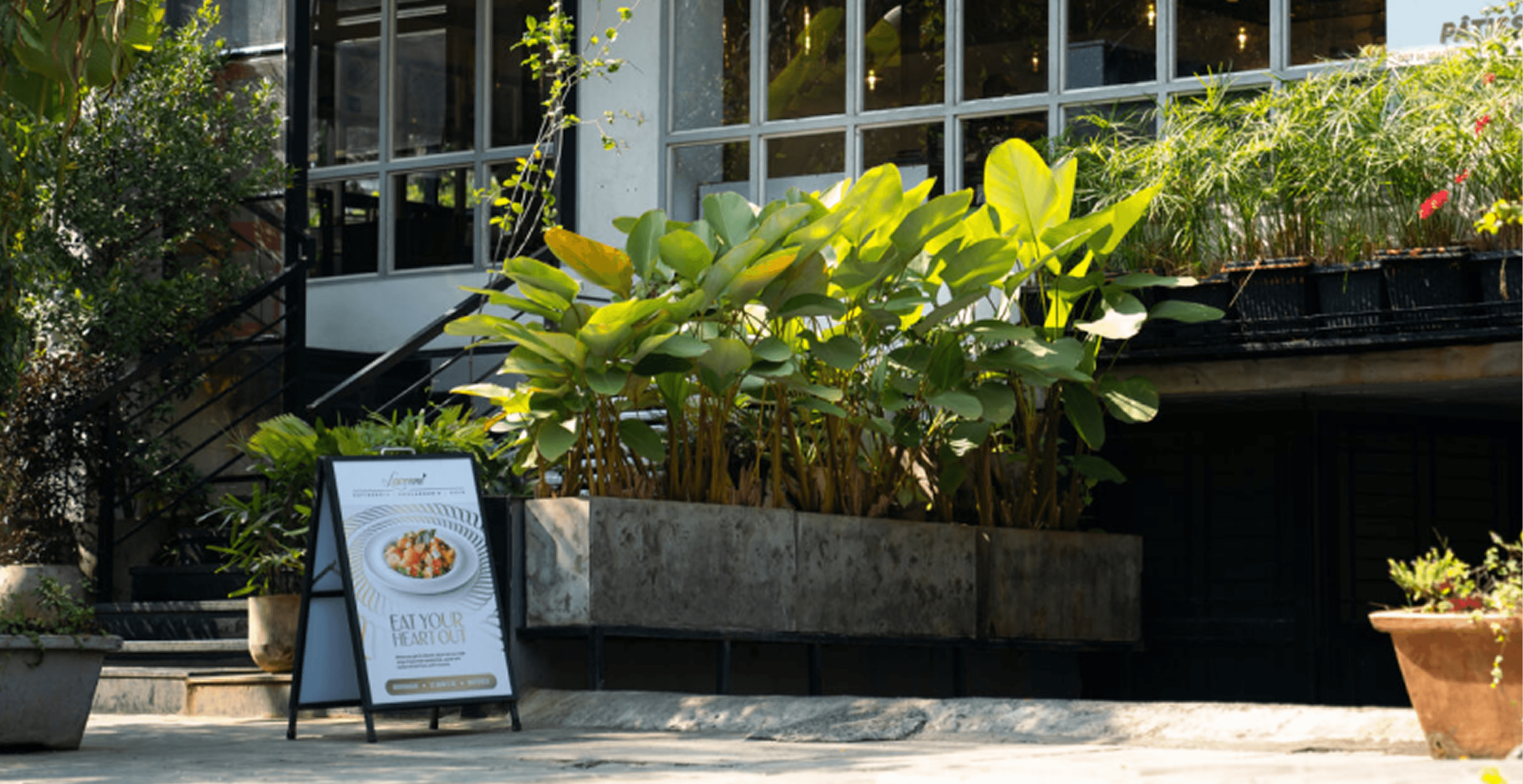 Lavonne Café storefront with greenery and signage
